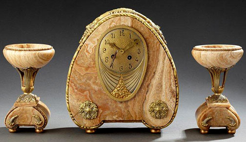 Trim-fireplace-clock Trim-fireplace-clock in white marble veined beige decorated with floral motifs in gilded bronze.Aguttes